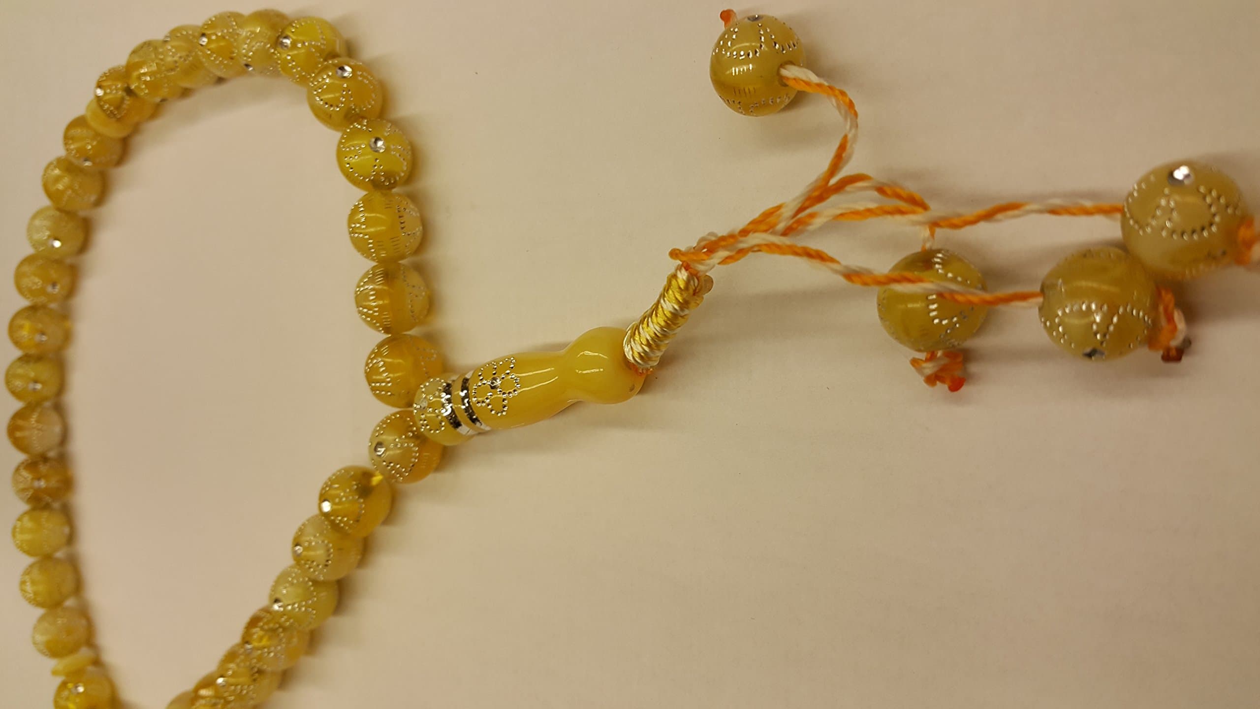 33 beaded yellow Tasbeeh with dimante pattern tasselled on end with thick braid