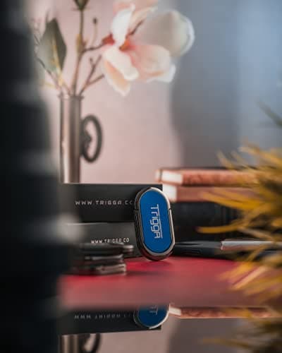 Trigga Lighter - Rechargeable Electric Mobile Phone Lighter, phone Kickstand, Finger Ring Grip (Blue Steel)