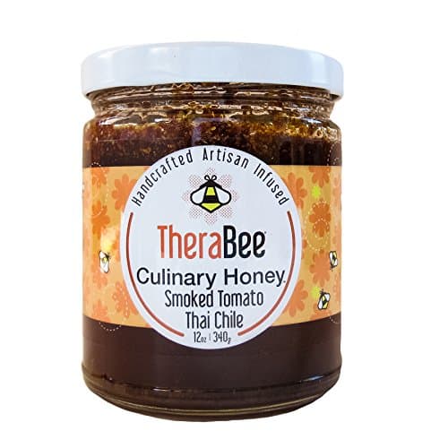 TheraBee Smoked Tomato-Thai Chile Culinary Honey. Made with 100% pure, raw, unheated, unfiltered, USA honey. Handcrafted and infused with organic dried tomatoes dehydrated and smoked over cherry wood and organic thai chiles. Spicy and tasty as a BBQ Glaze, drizzled over cheese, in salad dressings or straight out of the jar. 100% Natural. Gluten Free. Beautiful and unique gift idea for the foodie on your list.