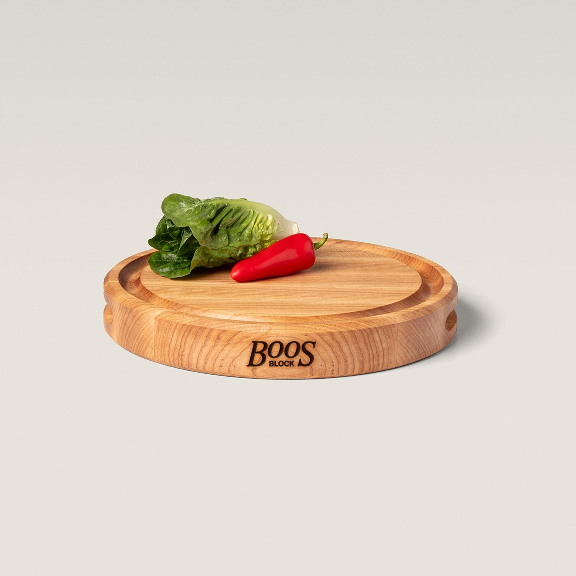 John Boos Chefs Round Board 30.5x4.5cm Sustainably sourced Maple wood. Integrated juice groove and finger grip. Reversible. Edge grain construction. Made in USA.