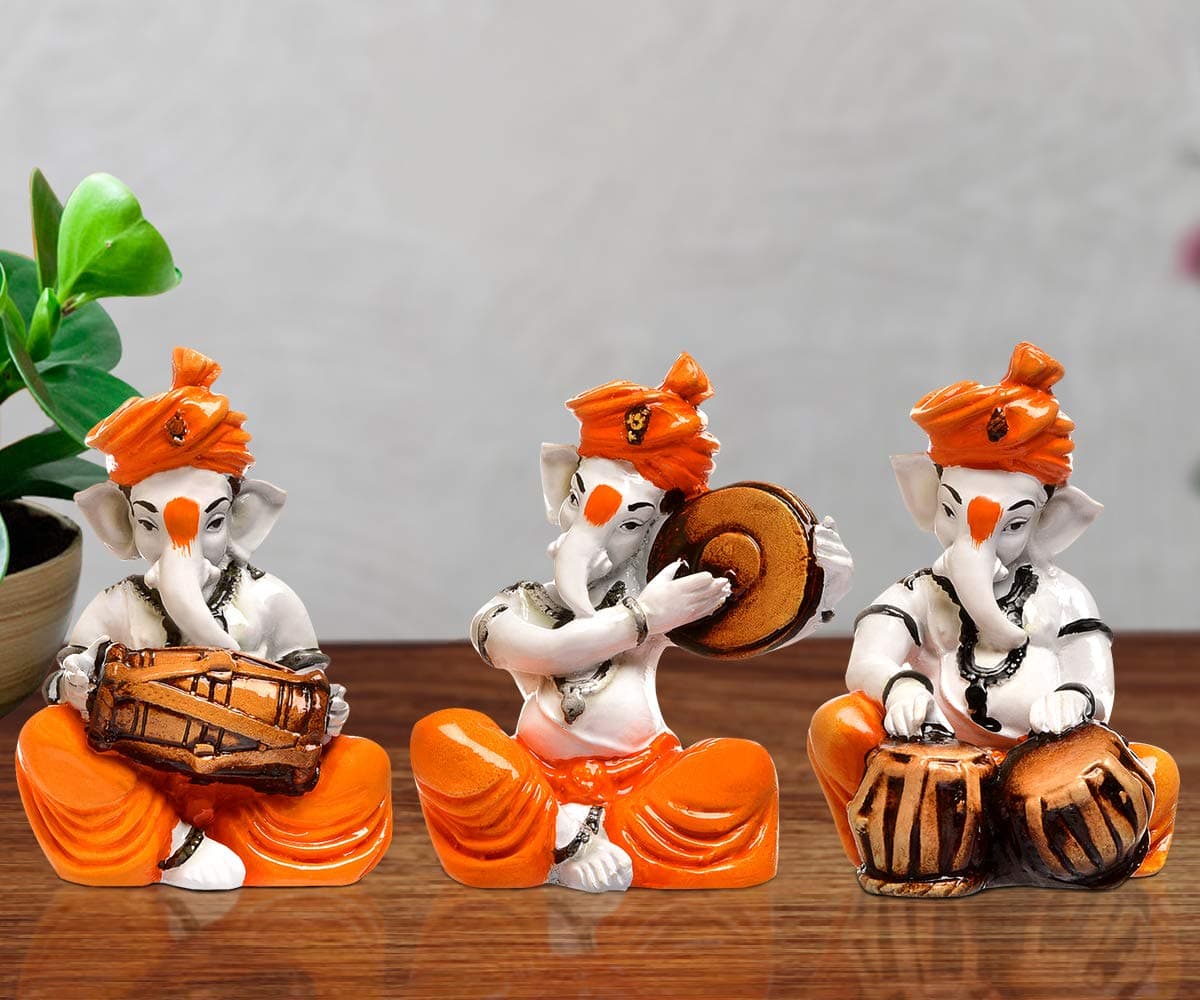 Karigaari India Karigaari Polyresine Orange & White Ganesha Playing Tabla