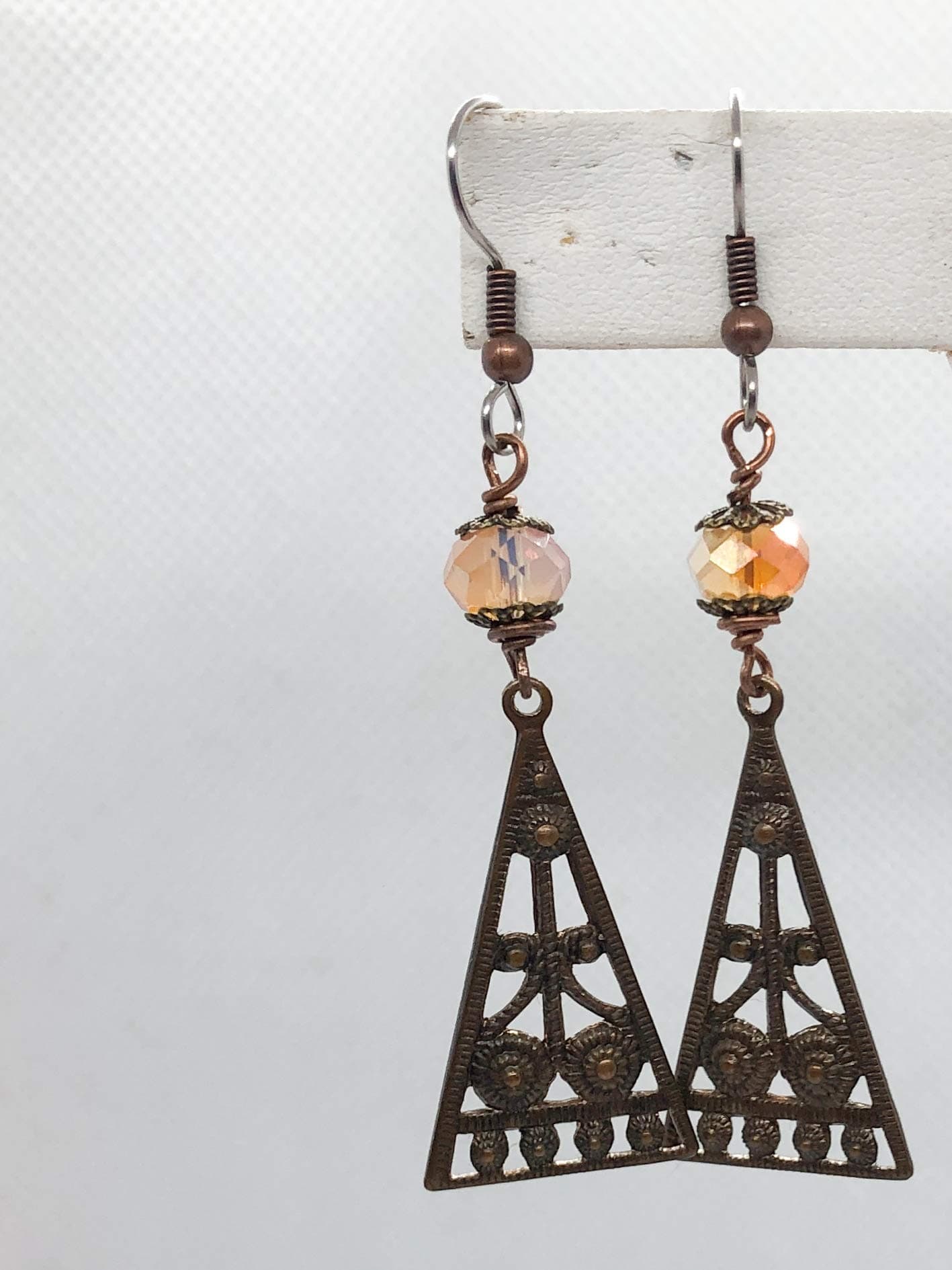 Egyptian Trellis Earrings - Egyptian Inspired Filigree Pyramids in Antique Brass - Peach Faceted Crystal Rondelles - Hung from a Hypo-Allergenic Surgical Steel French Hooks with Wrapped Wire Detail.