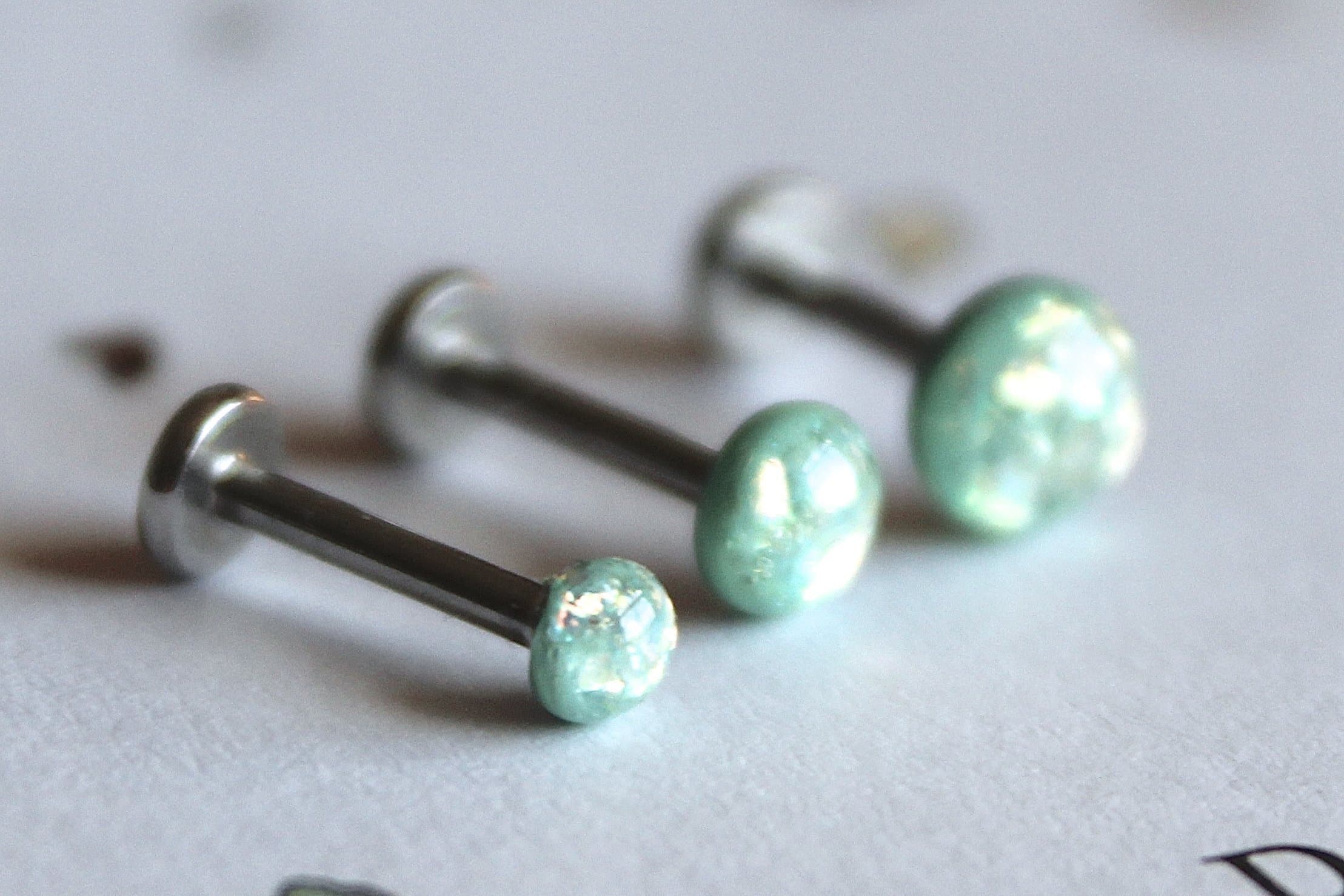 18g or 16g: Opalescent Light Teal Internally Threaded Triple Labret Set; 1.5mm, 2mm, 2.5mm, 3mm, 4mm, 5mm Gem Sizes; 5/32" (4mm), 1/4" (6mm), 5/16" (8mm), 3/8" (10mm), 15/32" (12mm) Lengths