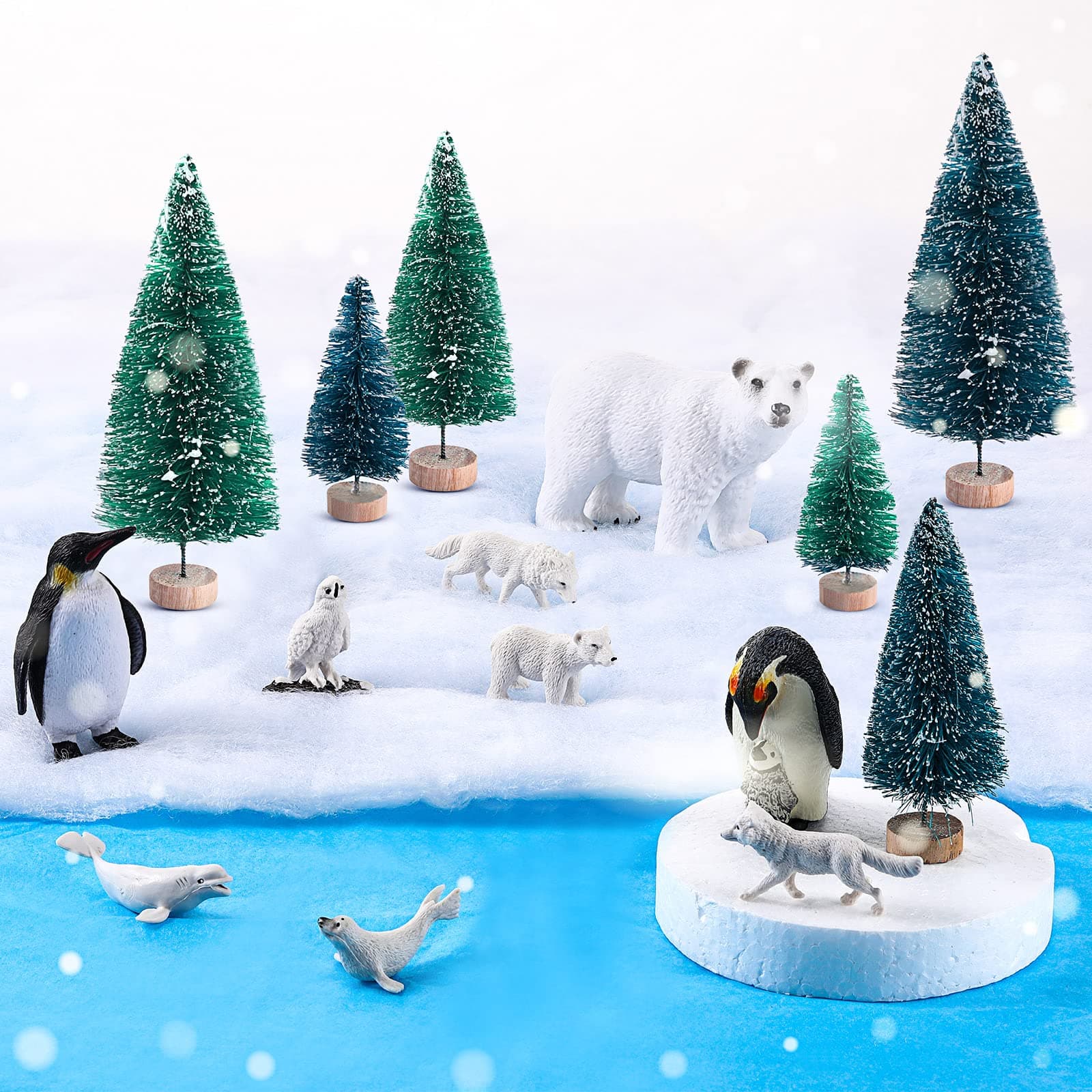 Sratte 19 Pcs Polar Animals Figurines Arctic Animal Toy Set includes 10 Polar Animals Figurines 6 Miniature Pine Trees 1 Foam Boards 1 Winter Fake Snow Blanket 2 Blue Tissue Paper for Kids